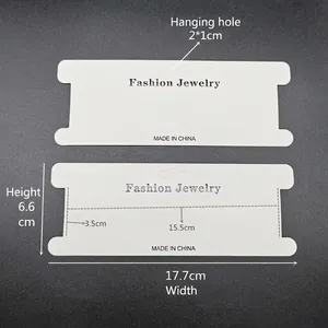 White cardboard hair accessory display card with Fashion Jewelry text and hanging hole