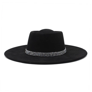 Detail of elegant black fedora hat featuring a sparkling rhinestone encrusted band