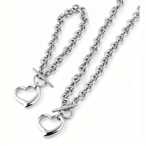 Minimalist silver steel necklace and bracelet set with hollow heart and toggle clasp