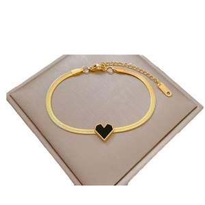 Golden stainless steel watch chain bracelet with black heart pendant displayed in a gift box