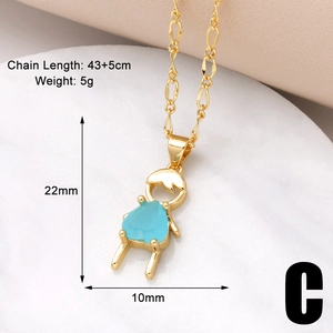 Close-up of gold plated boy girl necklace featuring a blue heart zircon and size details