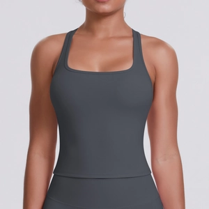Detail of the racerback design on a dark grey compression sports top for yoga and fitness