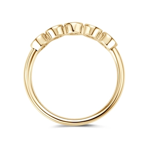 Detail view of a gold half eternity ring with five aligned stones in channel setting