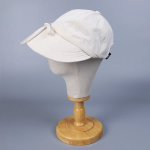 Women's cream nylon sun hat featuring a stylish bow strap and KL logo detail