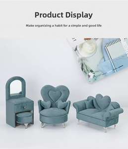 Miniature sofa-style jewelry boxes in velvet blue with mirrors and metal feet