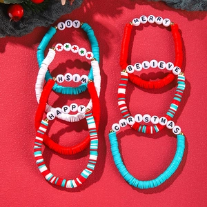 Detailed top view of Christmas clay bead bracelets with Joy and Merry letter charms