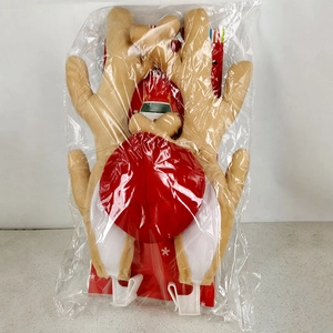 Detailed view of plush reindeer antlers and red nose car decoration in packaging