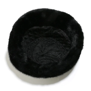 Detailed top view of the black faux fur bucket hat with quilted lining for warmth