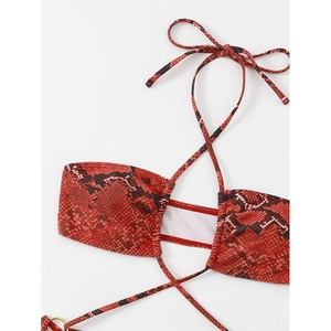 Red and black snakeskin print halter bikini top with ruched details on white background