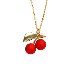 Chic gold-tone chain necklace featuring a vibrant red hand-painted cherry fruit pendant