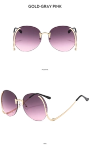 Frameless rimless round sunglasses with gold temples and gray-pink gradient lenses