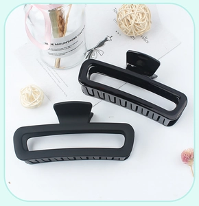 Detail of glossy and matte black leopard print hollow rectangle hair claw clips set