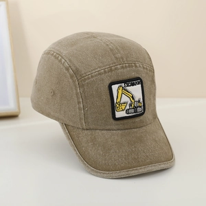Close-up of kids khaki cotton baseball cap with excavator embroidery and vintage texture