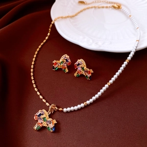 Detail of 18K gold plated horse necklace and earrings with pearls and colorful zircons