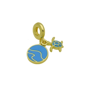 Detailed close-up of golden sea turtle charm with blue enamel waves on circular tag
