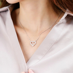 Elegant silver heart necklace with pavé-set stones on a delicate chain for women