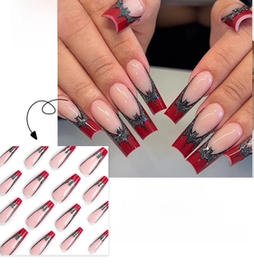Macro detail of long square press-on nails with red base and silver glitter bat designs