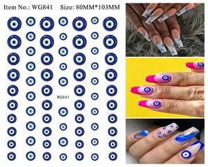Detail of blue evil eye nail stickers showing diverse application on various skin tones