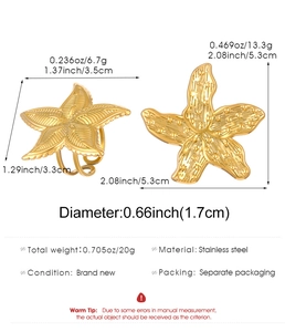 Detail view of gold starfish rings with size specs and high-gloss metallic texture