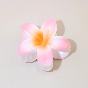 Haarklammer in Form einer Plumeria-Blüte mit rosa-orangefarbenem Farbverlauf