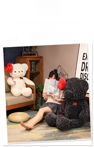 Detail of plush teddy bears with red heart balloons and decorative heart embroidery