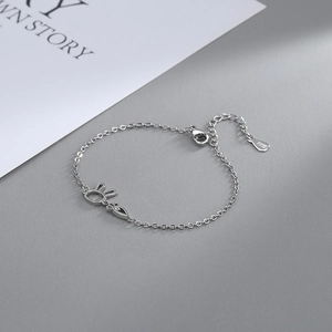 Close-up of S925 silver bracelet featuring bunny and carrot charms with adjustable chain