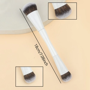 Dual-ended makeup brush with white handle and gradient bristles measuring 18cm long