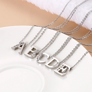 Sparkling crystal initial letter necklaces A to E made of silver-toned stainless steel