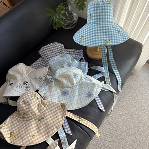 Collection of wide brim sun hats with plaid patterns and floral embroidery details