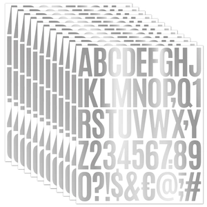 Macro detail of silver metallic alphabet and number stickers with glossy finish