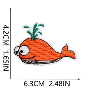 Detailed view of cute orange whale embroidery patch with size measurements 6.3cm x 4.2cm