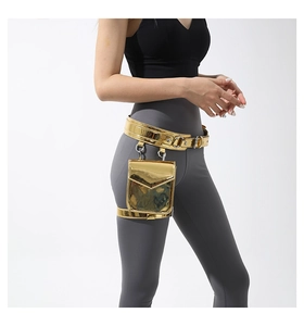 Detail of metallic gold leg bag and waist pack with adjustable straps on model