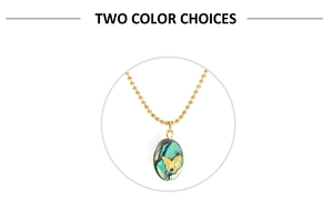 Detail of golden bead chain necklace featuring an oval abalone shell butterfly pendant