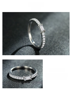Macro detail of S925 sterling silver ring with emerald cut zircon and pave stones