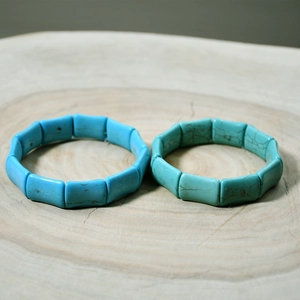 Close-up of rectangular turquoise stretch bracelets showing natural veining and texture
