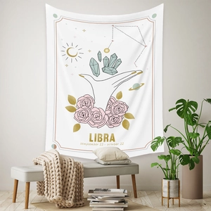 Detail of Libra constellation tapestry with crystal and rose design in cozy room setting