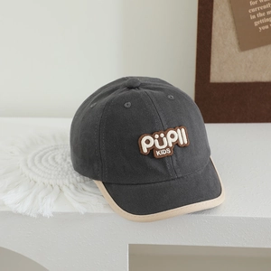 Close-up of kids dark grey baseball cap with PUPII KIDS embroidery patch and canvas texture