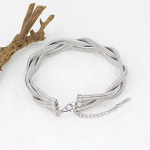 Close-up of triple-strand silver woven choker with K18 tag and adjustable lobster clasp