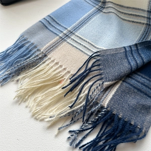 Thick cashmere-like plaid scarf in blue and grey with fringe edges for winter warmth