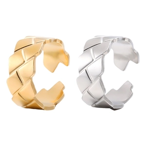 Close-up of woven texture adjustable open rings in polished gold and silver steel finish
