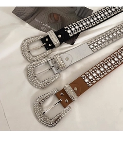 Detailed view of three punk Y2K waistbands with rhinestones in black silver and brown