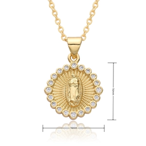 Macro shot of 16mm gold religious pendant with embossed Virgin Mary and zircon halo
