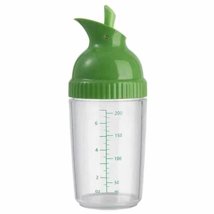 Detail of transparent squeeze bottle showing clear oz and ml measurement scales