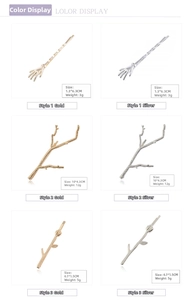 Detailed size and weight specs for gold and silver metal skull hand and branch hair clips