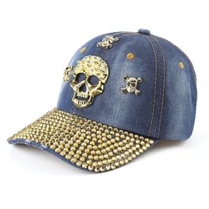 Blue washed denim baseball cap with gold 3D skull and metallic rivet accents