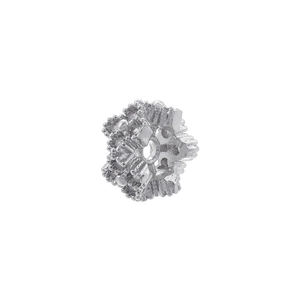 Detailed macro view of silver-plated jewelry spacer bead with intricate textured pattern