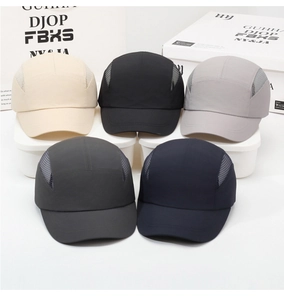 Detail of five quick-dry breathable mesh baseball caps stacked in multiple colors