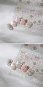 Detail of 3D embossed M-916 nail art stickers with pink bows and white lace patterns