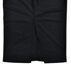 Detailed view of the side slit hem and textured fabric on this black long sleeve dress