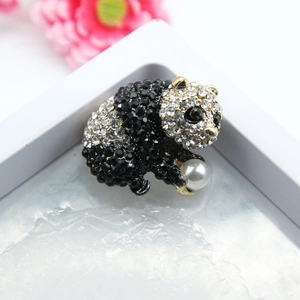 Sparkling panda brooch with black and white rhinestones and a white faux pearl accent